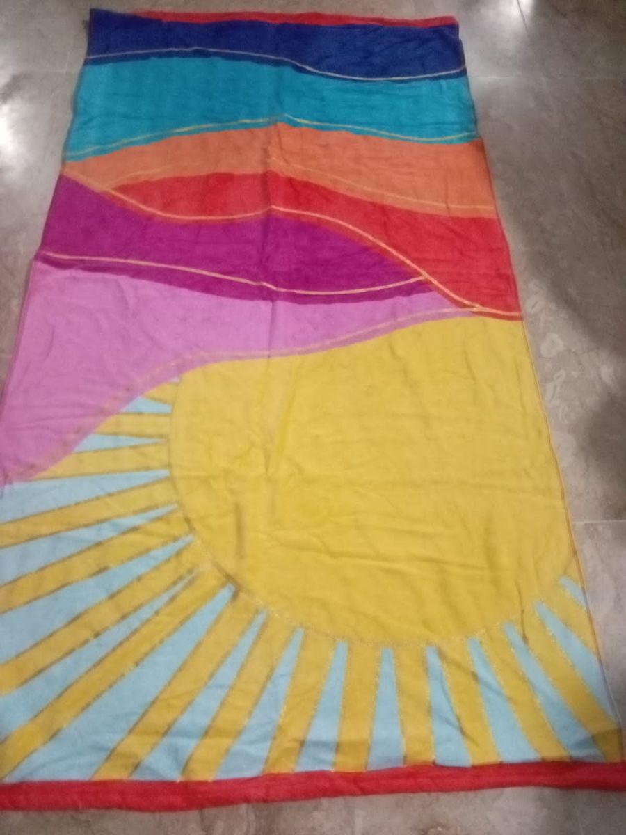 Printed beach towel in sunset colours